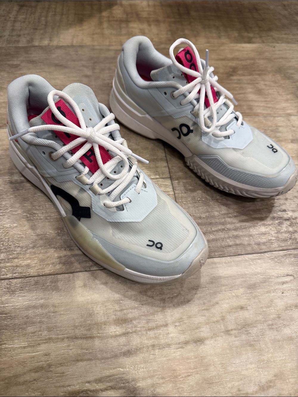 On Running Women's White Roger Sneakers with Pink Tongue Accents